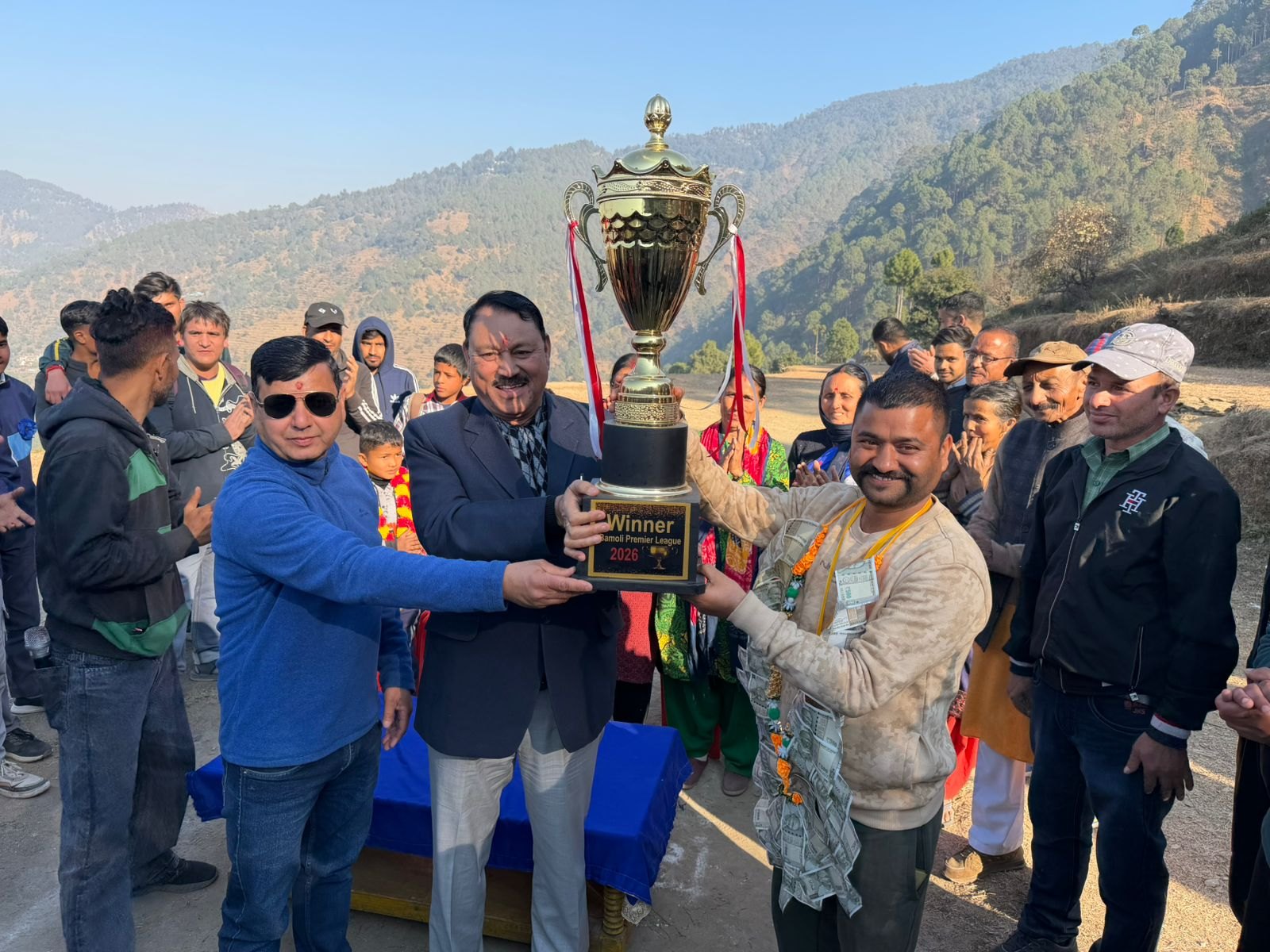 Winners receiving trophy during Bamoli village cricket tournament organised by Om Yugam Foundation